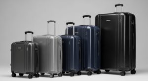 Various luggage sizes lined up showing small carry-on to large checked suitcase dimensions